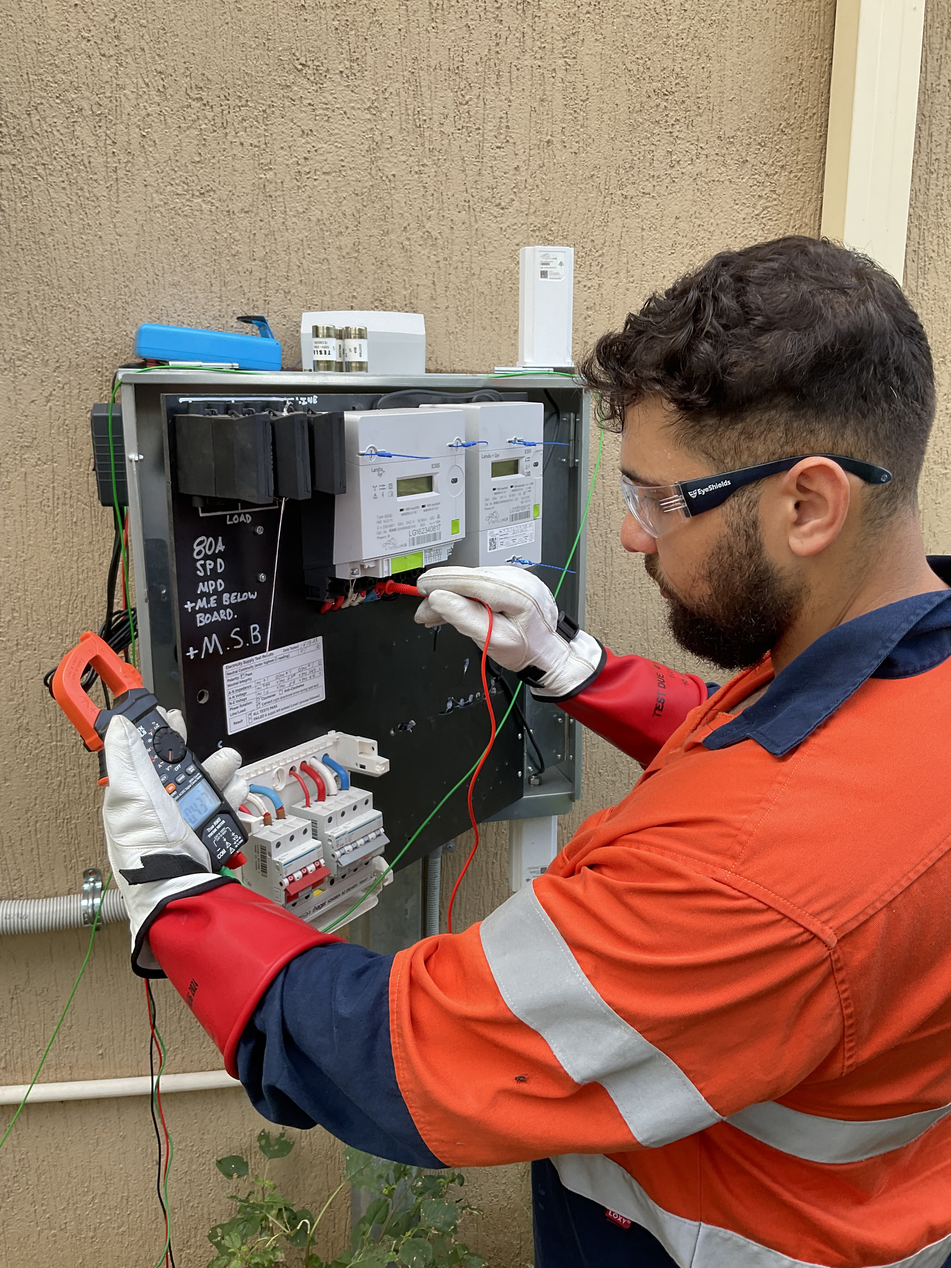 Licensed electrician working on a switchboard